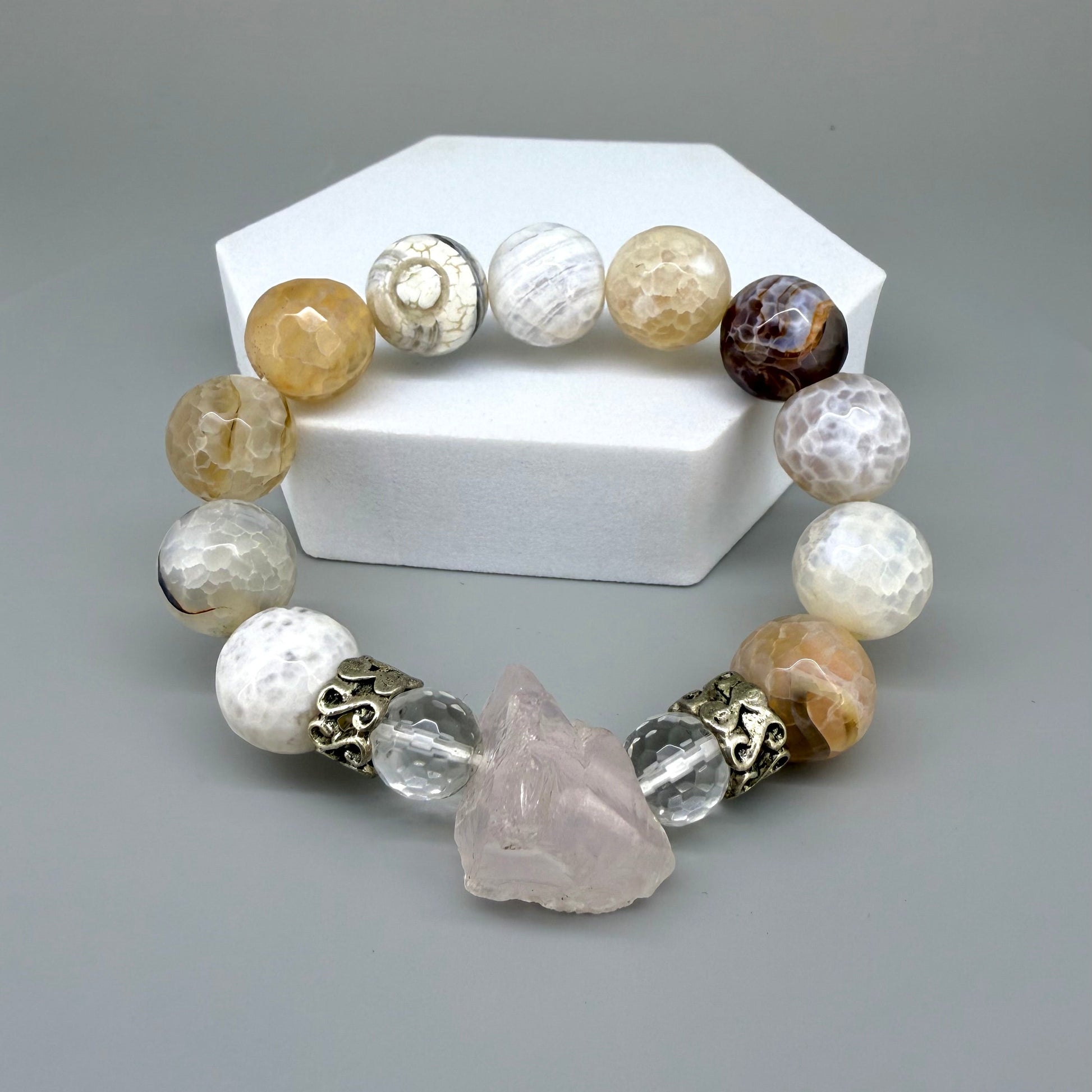 Dragon vein agate beaded bracelet, 18cm, beige-brown patterned gemstone beads with carved rose quartz focus stone and silver accents on elastic stretch band.