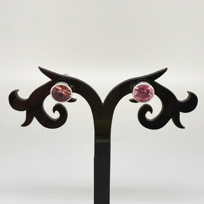 White gold stud earrings featuring round-cut zircons in a classic setting.