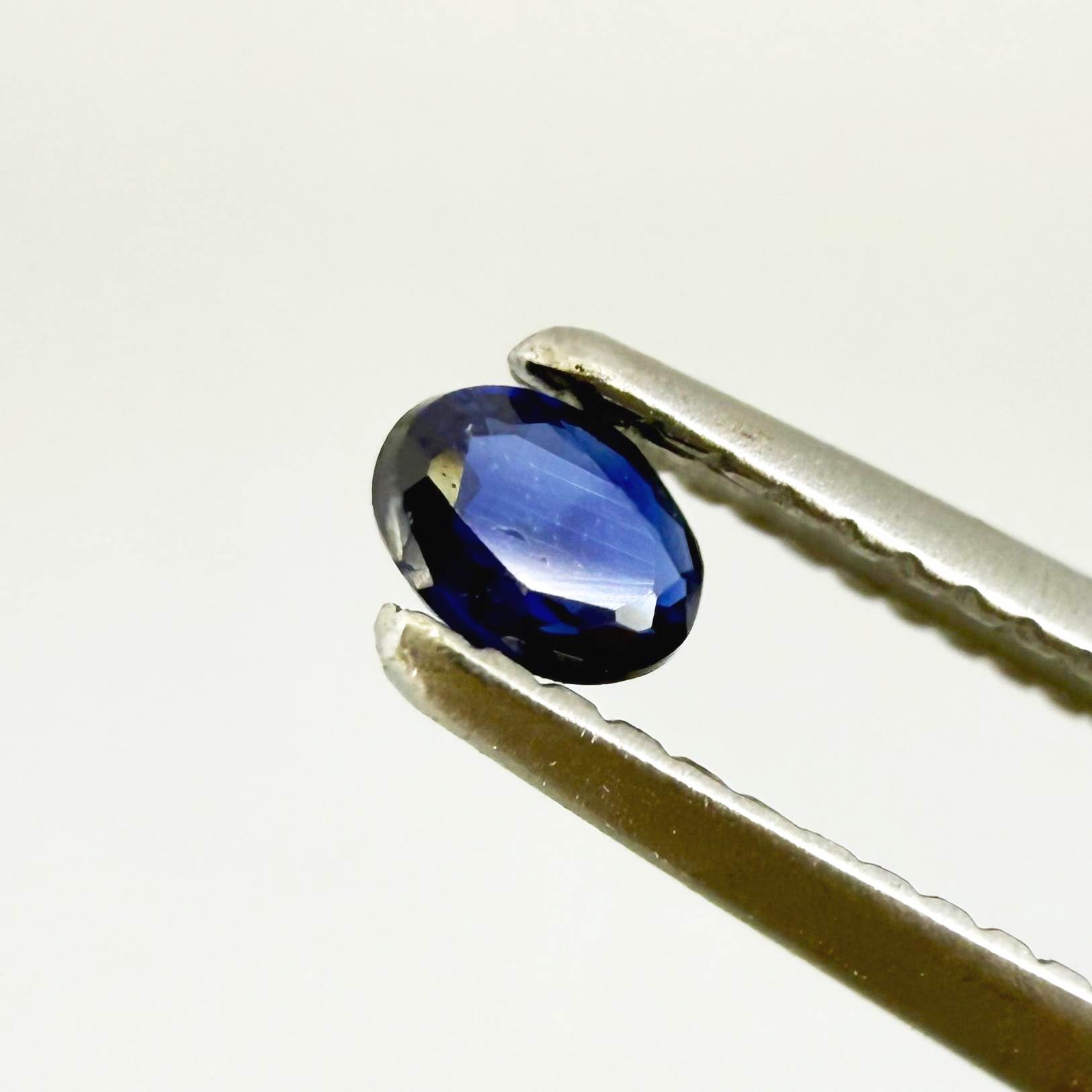 0.09 ct natural blue sapphire from Pailin, Cambodia, oval cut.