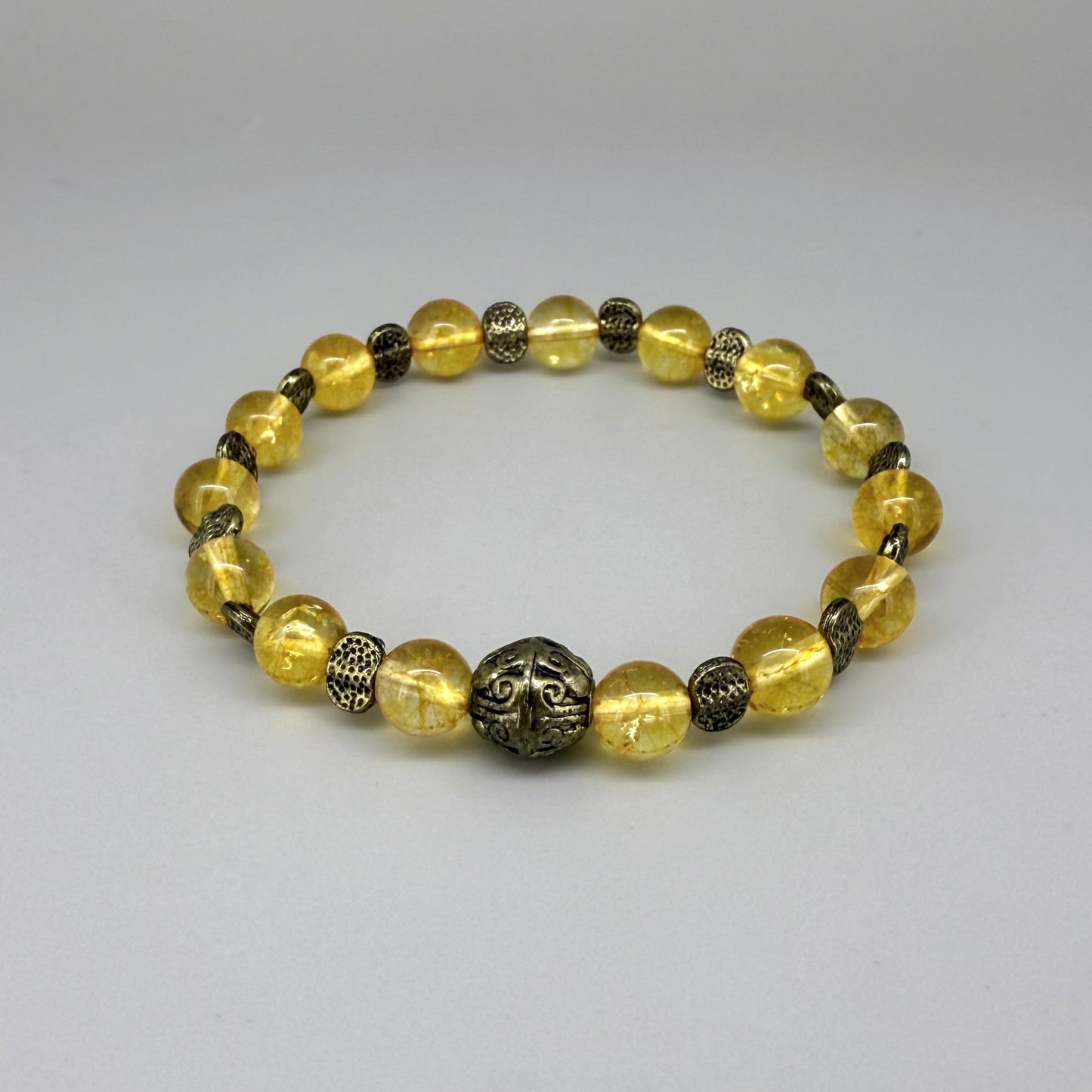 Citrine beaded bracelet, 18cm, golden-yellow gemstone beads with metal spacers on elastic stretch band.