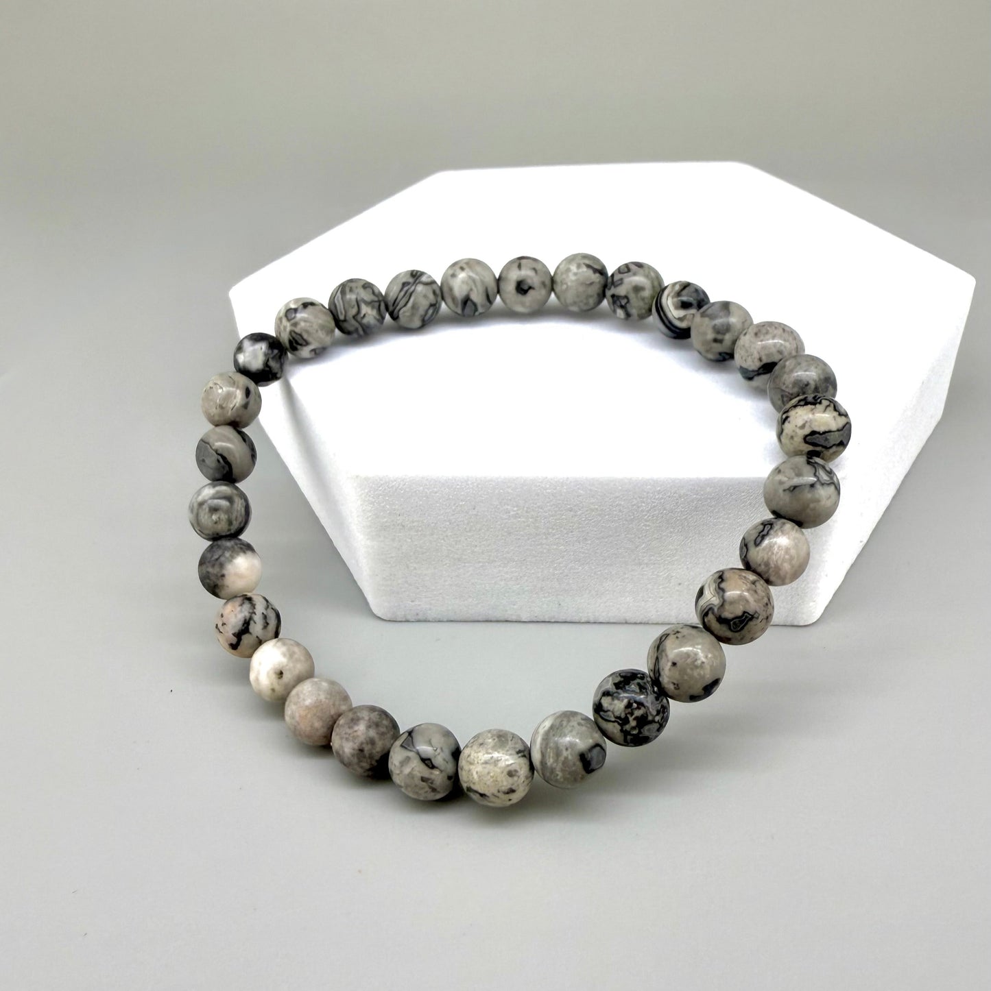 Jasper beaded bracelet, natural grey, black, and white marbled gemstone beads on elastic stretch band.