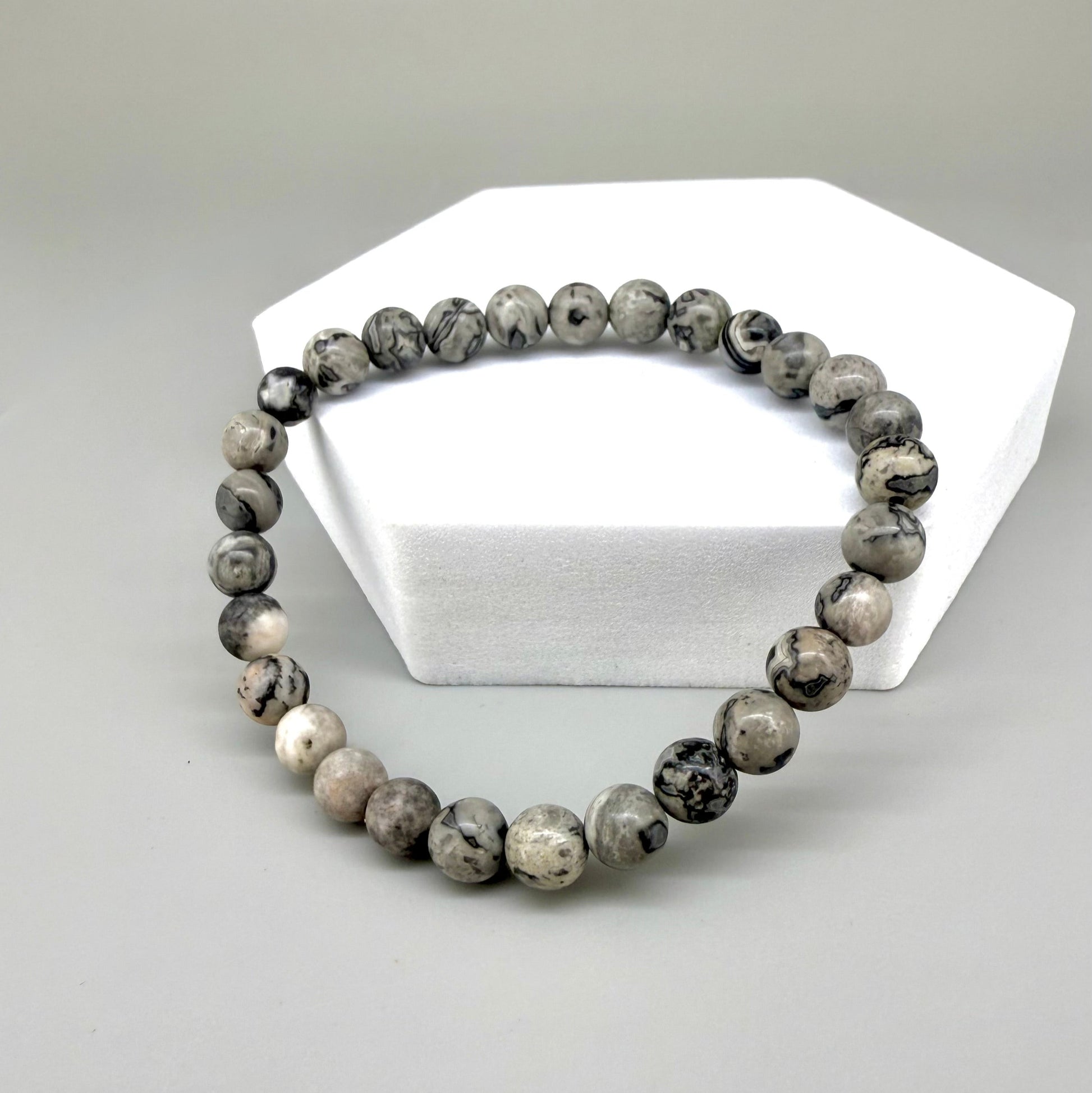 Jasper beaded bracelet, natural grey, black, and white marbled gemstone beads on elastic stretch band.