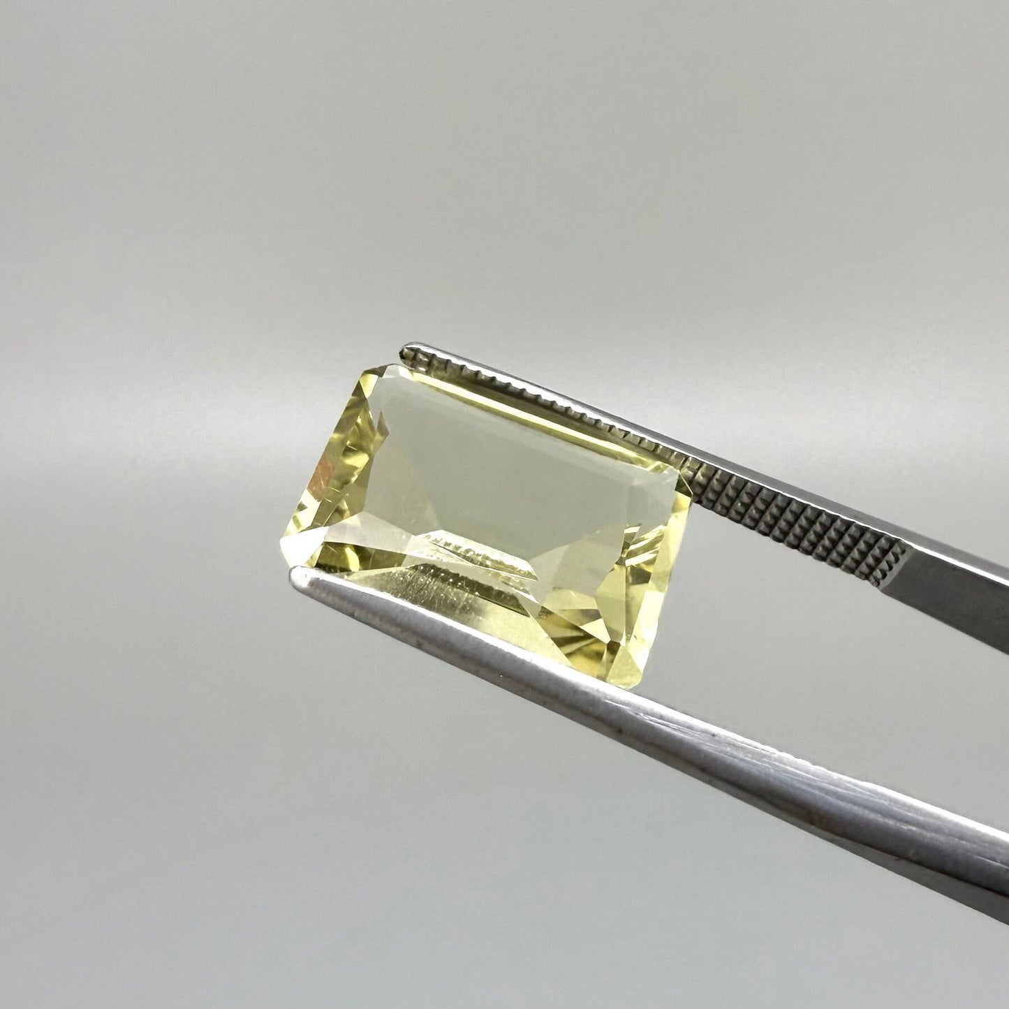 5.6 ct natural lemon quartz, faceted with bright yellow color.
