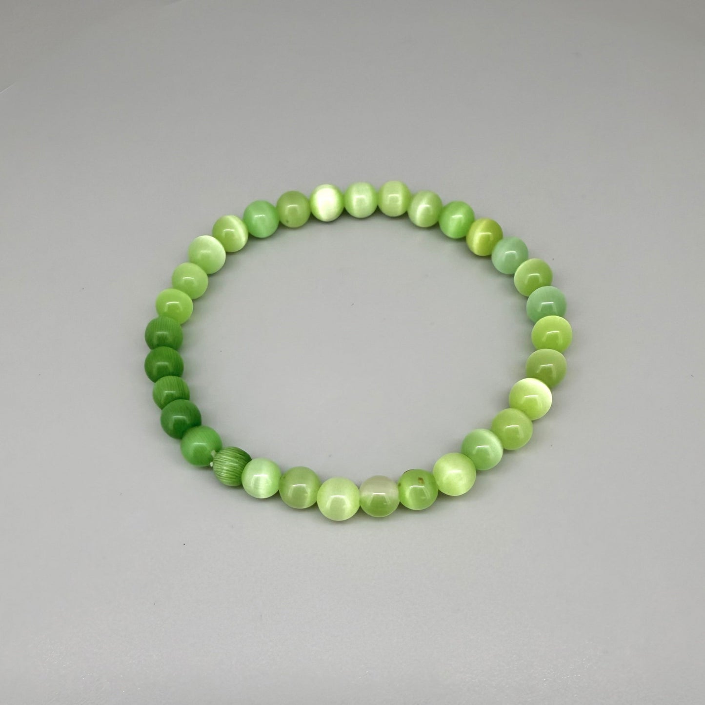 Cat’s Eye beaded bracelet, 18cm, natural shimmering grey gemstone beads on elastic stretch band.