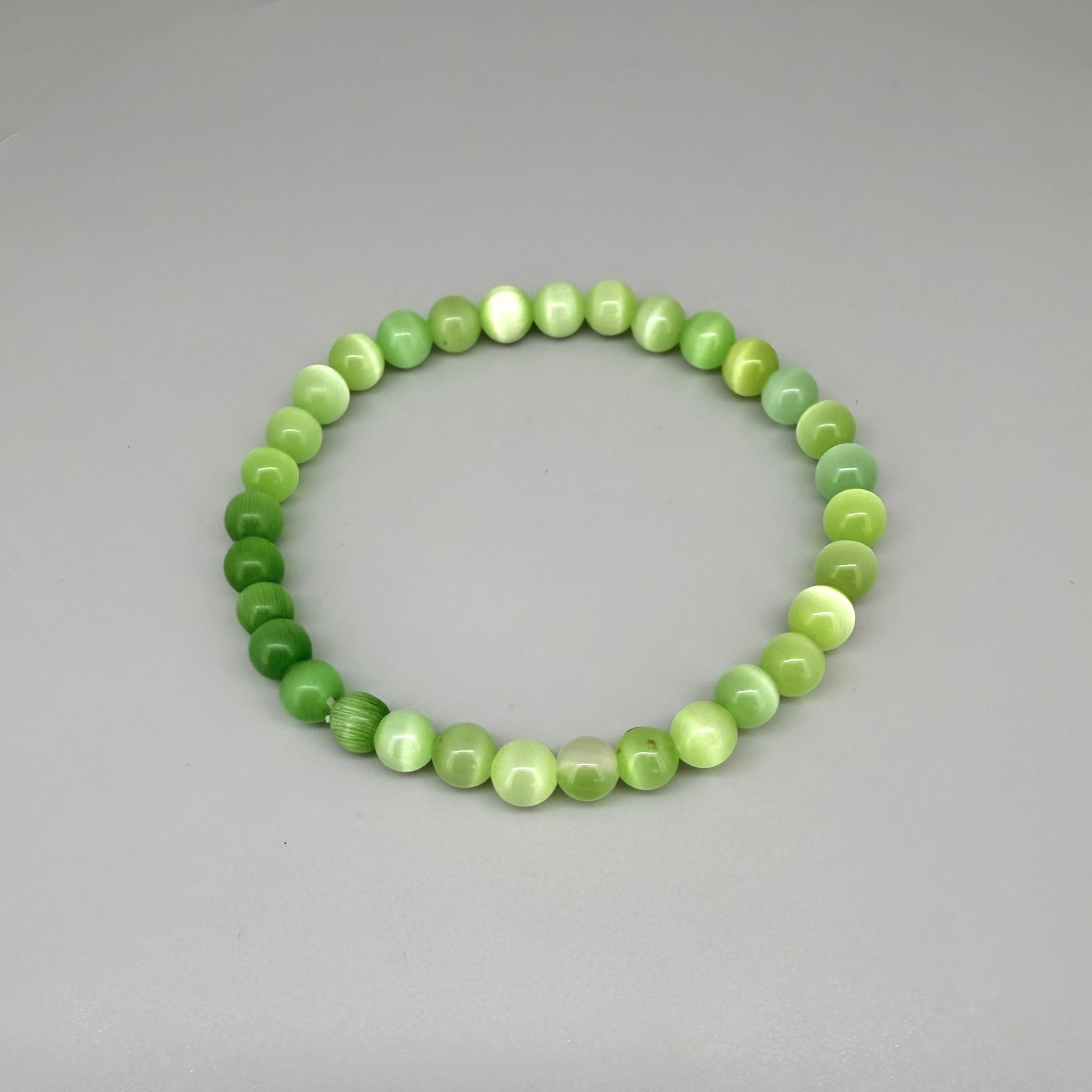 Cat’s Eye beaded bracelet, 18cm, natural shimmering grey gemstone beads on elastic stretch band.