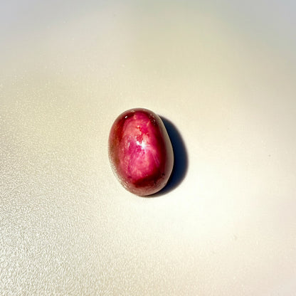 36.1 ct natural Pink-Red Star Ruby cabochon from Mozambique with soft star effect and polished dome.