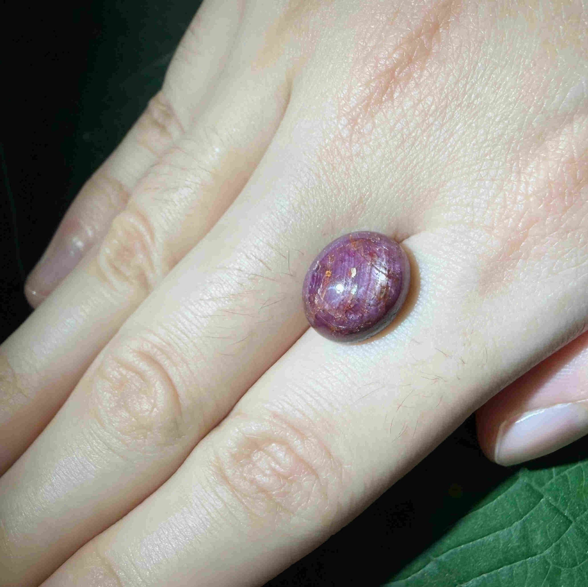 11.2 ct natural wine-red Star Ruby cabochon with soft star effect and polished dome.