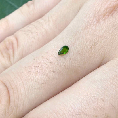 0.14 ct natural green diopside, pear cut.