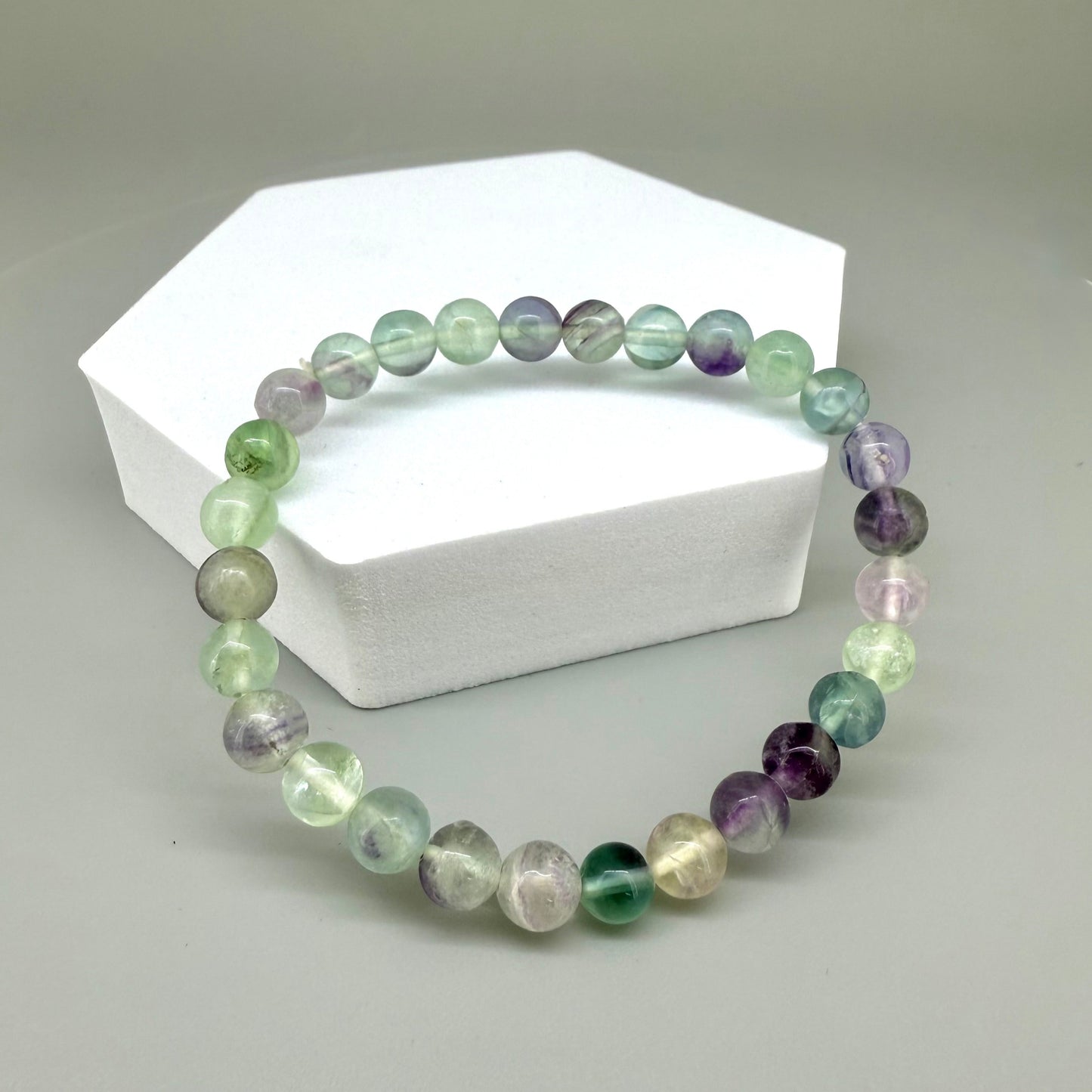Fluorite beaded bracelet, 18cm, natural gemstone beads in mixed pastel tones on elastic stretch band.