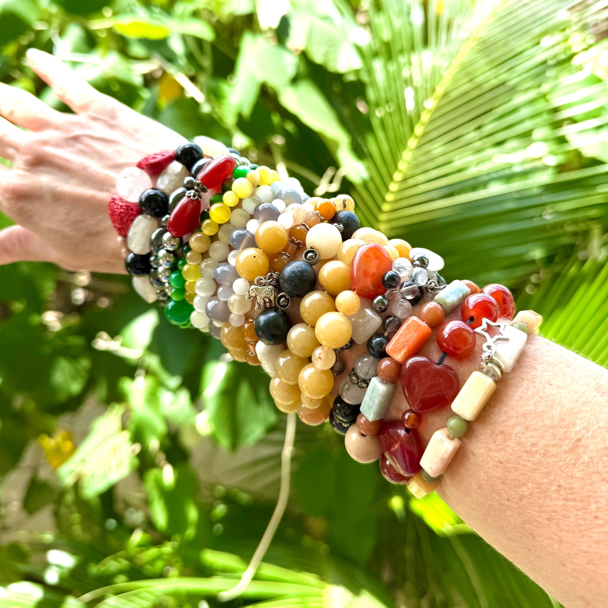 Multi Natural Gemstone Beads presented on arm
