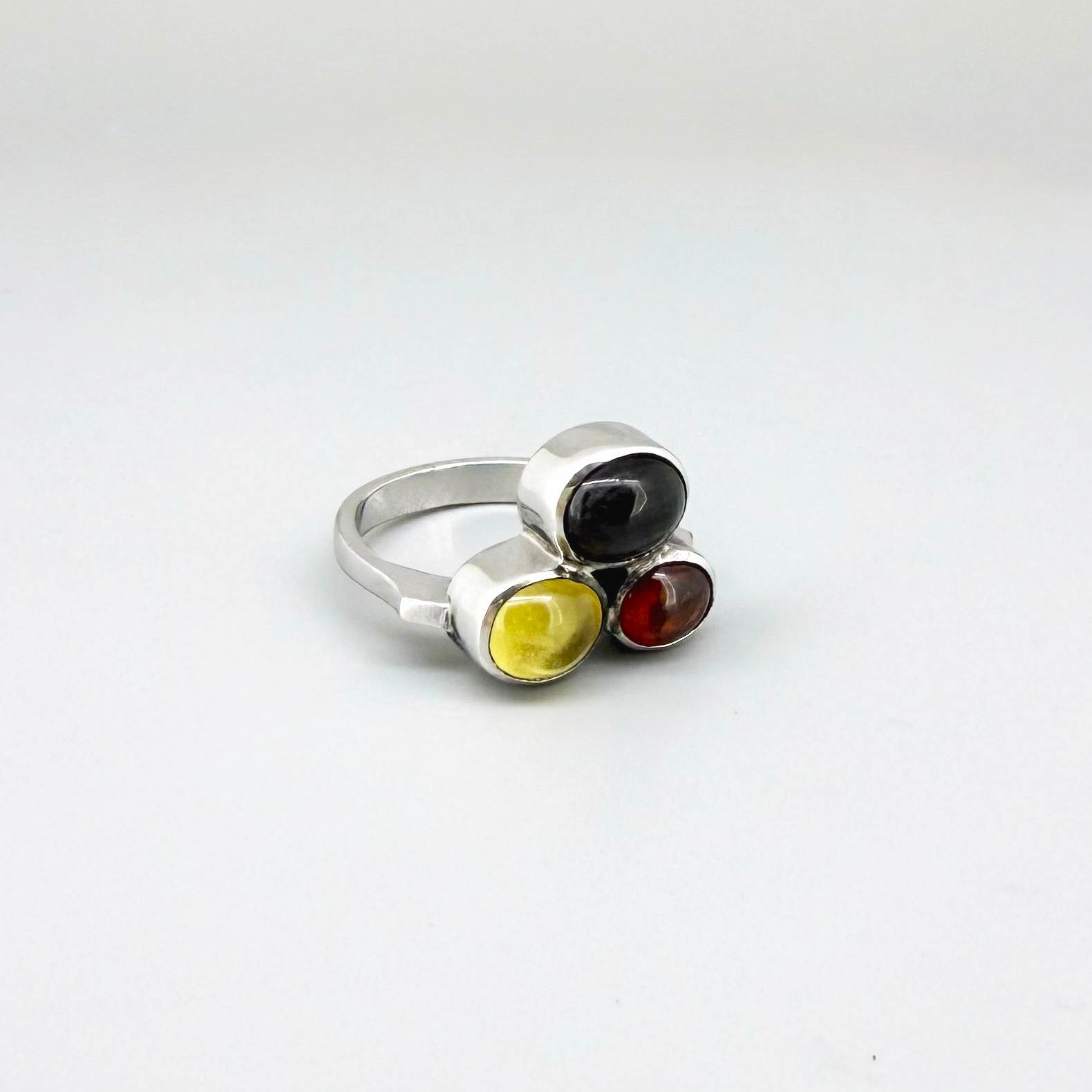 Handmade sterling silver ring with citrine, garnet and cat’s eye gemstones.