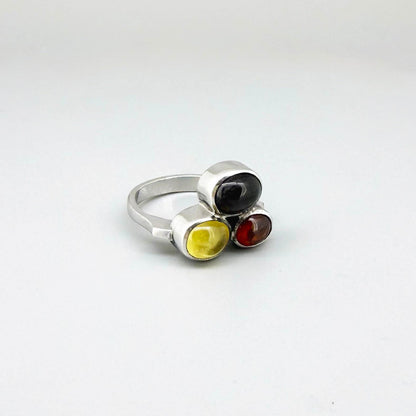 Handmade sterling silver ring with citrine, garnet and cat’s eye gemstones.
