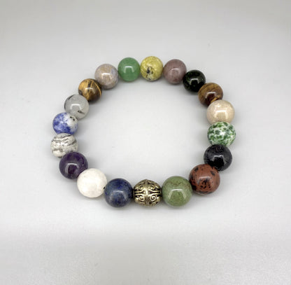 Multi-gemstone beaded bracelet, 18cm, with lapis lazuli, quartz, moonstone, amethyst, jasper, green fluorite, and rutilated quartz beads on elastic stretch band.