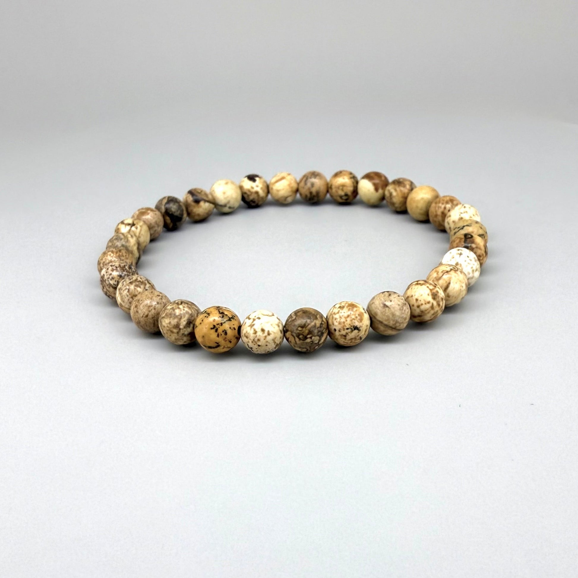 Jasper beaded bracelet, natural gemstone beads in light earthy tones on elastic stretch band.