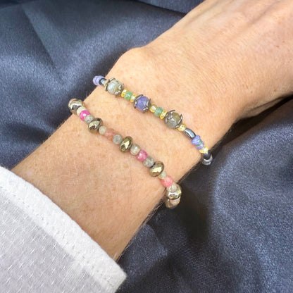 Faceted sapphire and hematite beaded bracelet with lobster clasp on neutral background