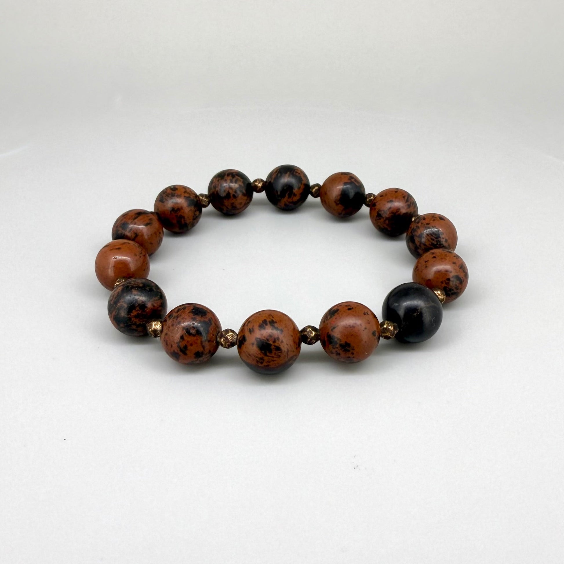 Mahogany obsidian beaded bracelet, 17cm, natural brown and black gemstone beads with small copper accents on elastic stretch band.