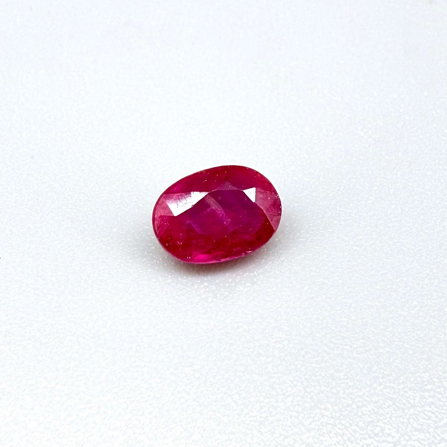 1.7 ct natural pink-red Songea ruby, oval cut.