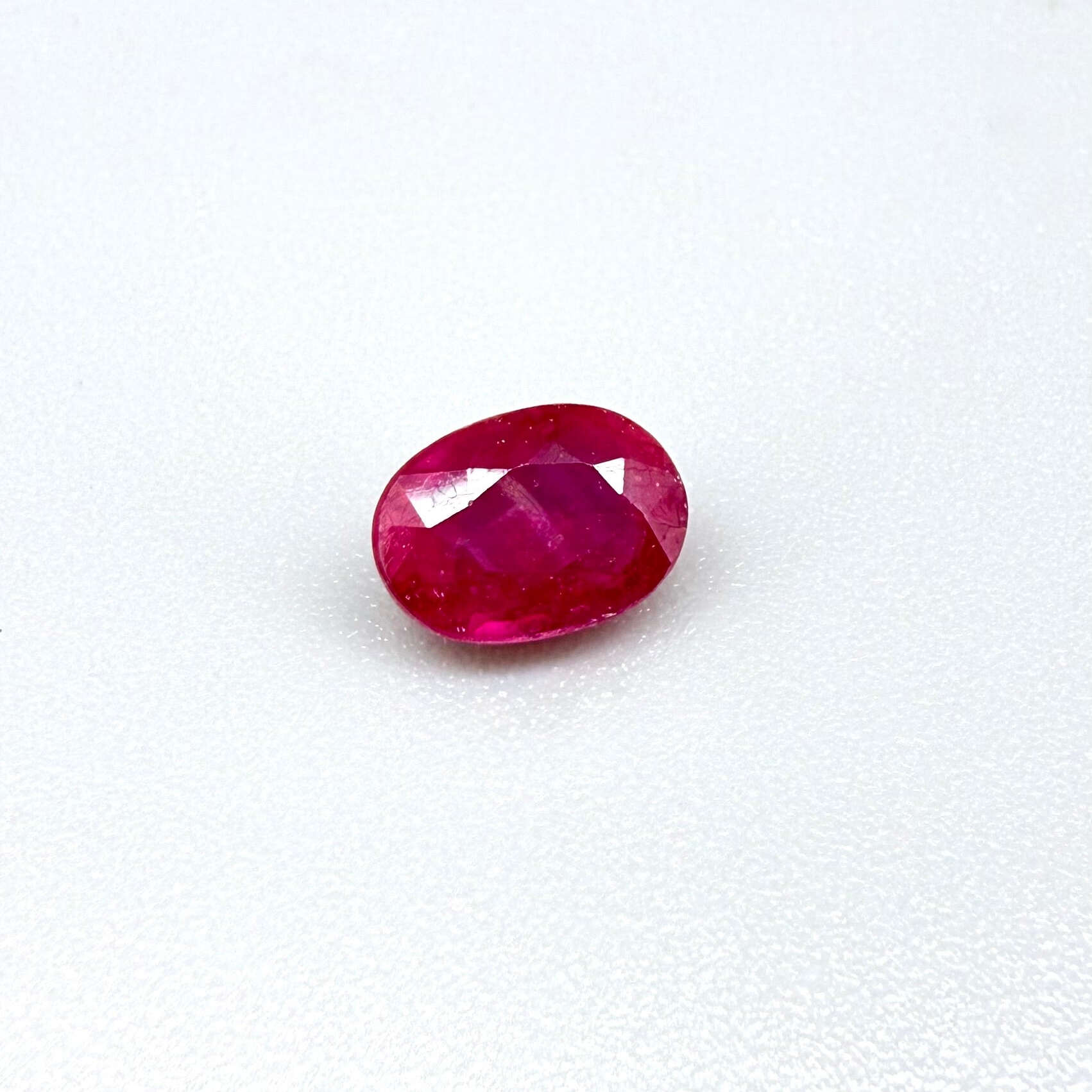 1.7 ct natural pink-red Songea ruby, oval cut.