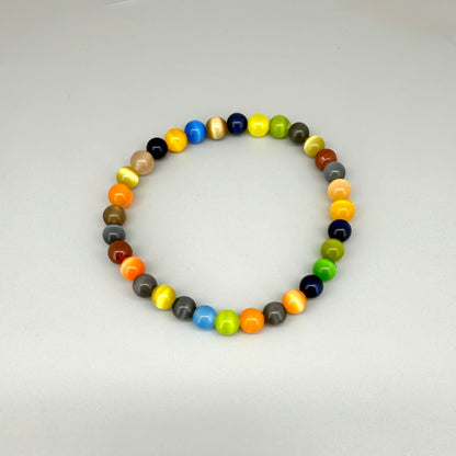Multicolor cat’s eye beaded bracelet, 18cm, vivid gemstone beads in bright, brown, and black tones with shimmering effect on elastic stretch band.
