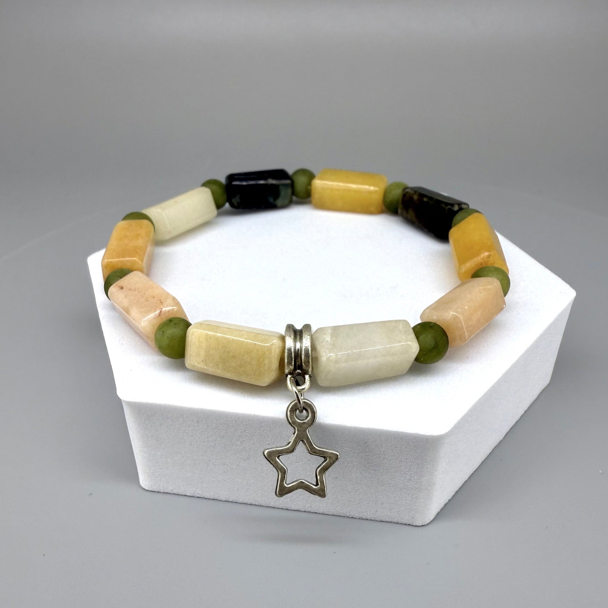 Jade beaded bracelet, 19cm, dark green, cream, and yellow baguette-style stones with round green beads and star charm on elastic stretch band.