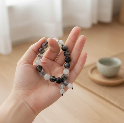 Rutilated quartz mala bracelet made from natural rutilated quartz beads, symbolizing clarity, focus, and inner direction.
