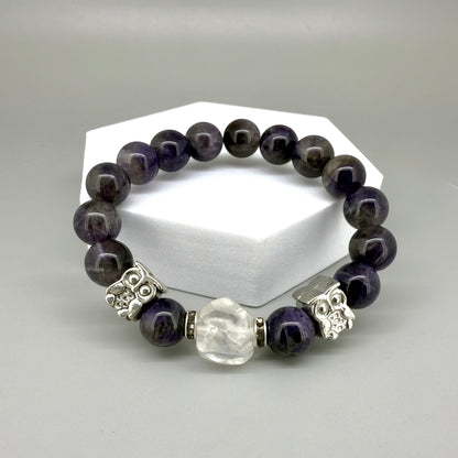 Amethyst beaded bracelet, 18cm, violet gemstone beads with large clear white focal stone and two owl accents on elastic stretch band.