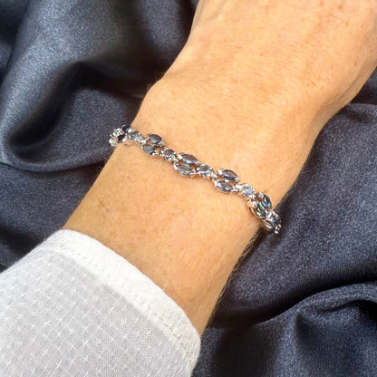 White gold plated sapphire bracelet in sterling silver on neutral background
