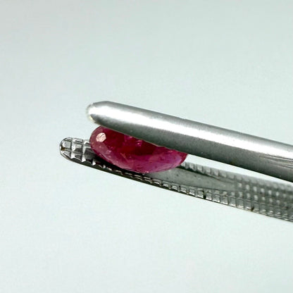 0.5 ct natural pink-red Songea ruby, oval cut.