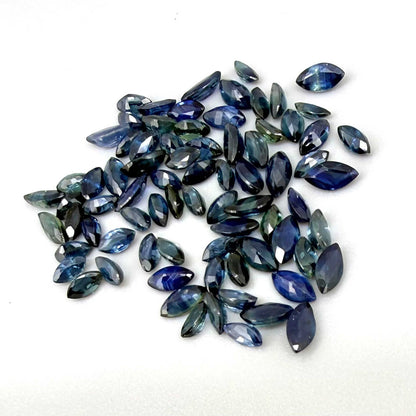 13.2 ct natural sapphire lot from Thailand, marquise cut stones in mid-to-dark vibrant blue hues.