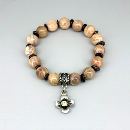 Sunstone and garnet chip beaded bracelet, 18cm, beige and brown gemstone beads with red garnet chips and flower charm on elastic stretch band.