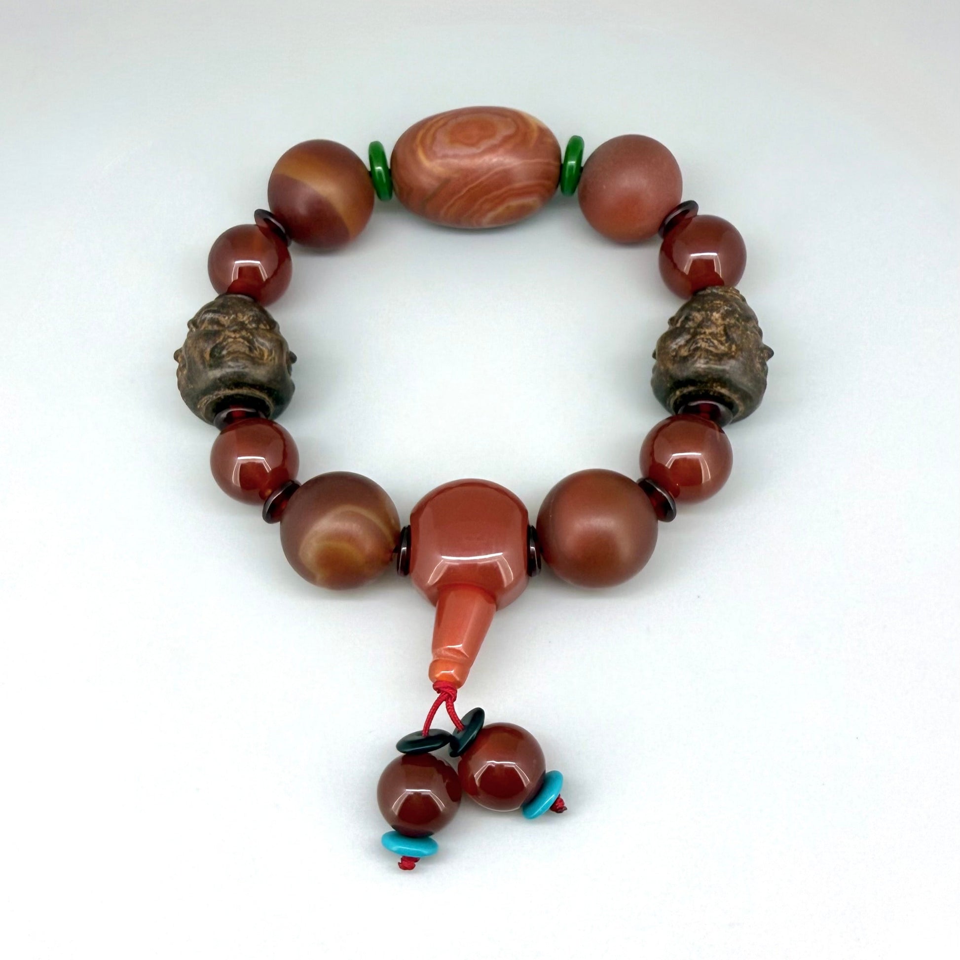 Agate and carnelian beaded bracelet, 20cm, with fiery red, orange, and colorful accent beads on elastic stretch band.