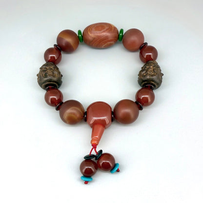 Agate and carnelian beaded bracelet, 20cm, with fiery red, orange, and colorful accent beads on elastic stretch band.
