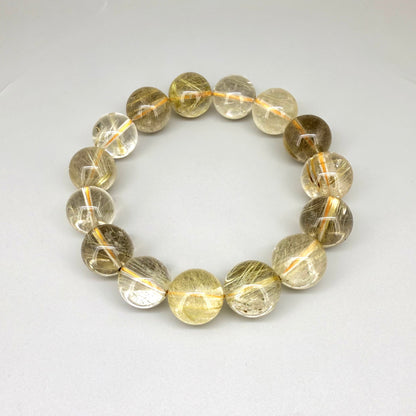 Rutilated quartz beaded bracelet, 18cm, natural gemstone beads with golden rutile threads on elastic stretch band
