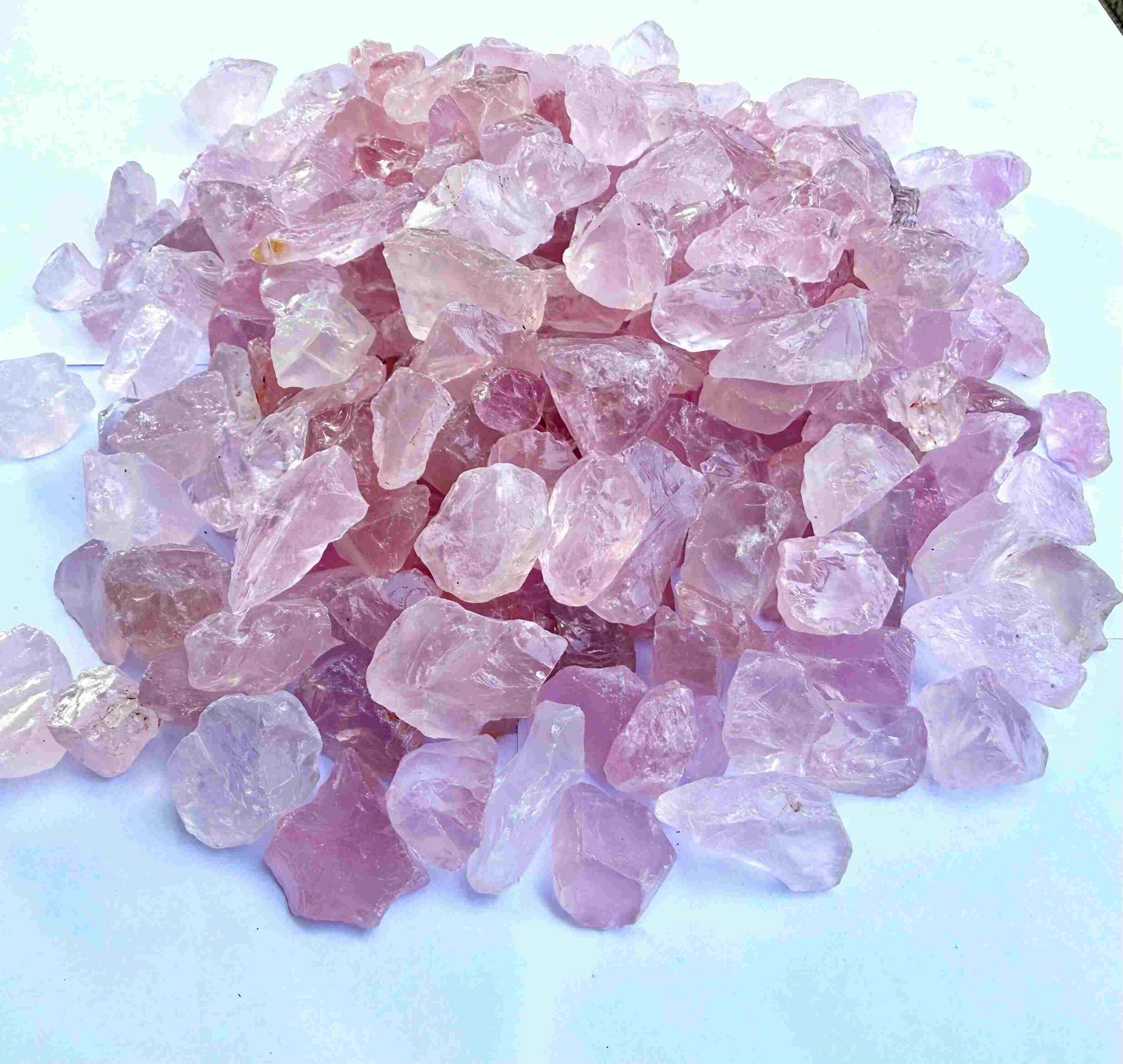 Natural rose quartz rough stones, untreated pink quartz in raw form for lapidary and jewelry projects