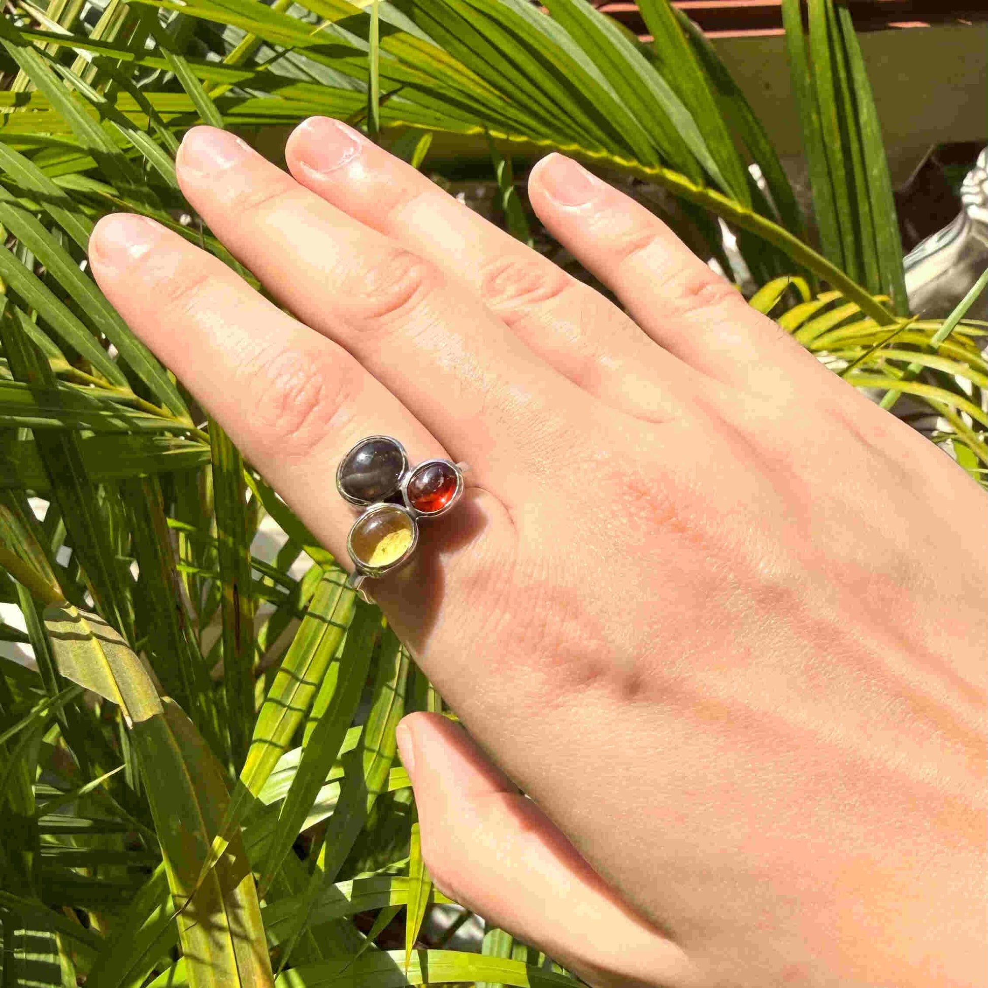 Handmade sterling silver ring with citrine, garnet and cat’s eye gemstones.