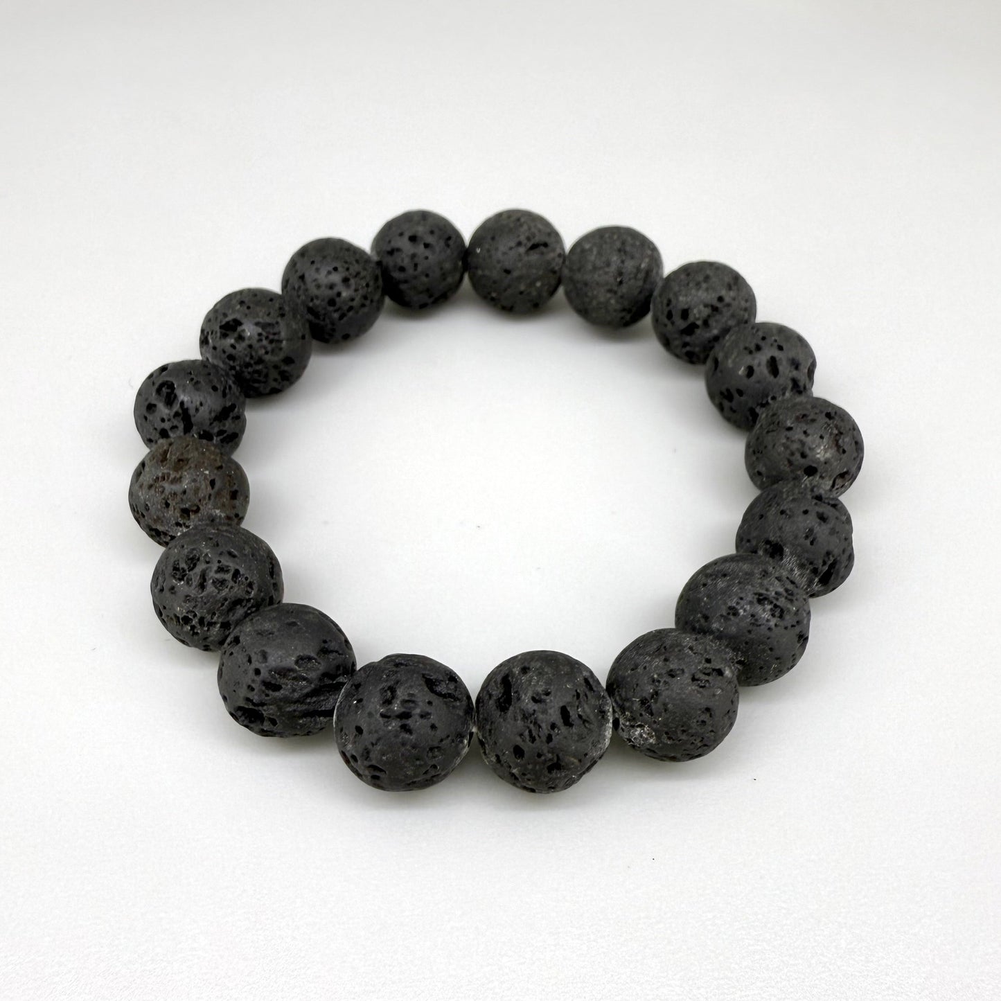 Lava beaded bracelet, 16cm, natural matte black porous gemstone beads on elastic stretch band.