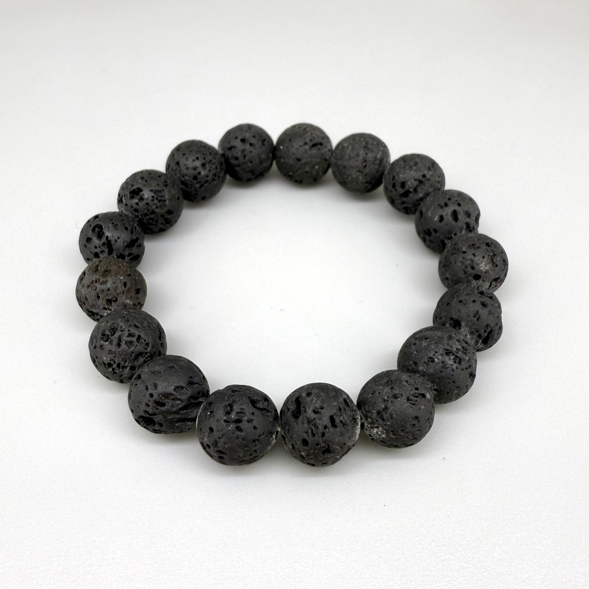 Lava beaded bracelet, 16cm, natural matte black porous gemstone beads on elastic stretch band.