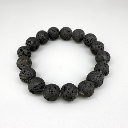 Lava beaded bracelet, 16cm, natural matte black porous gemstone beads on elastic stretch band.