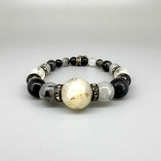 Rutilated quartz beaded bracelet, 18cm, black rutile inclusions with larger light bead and star charm on elastic stretch band.