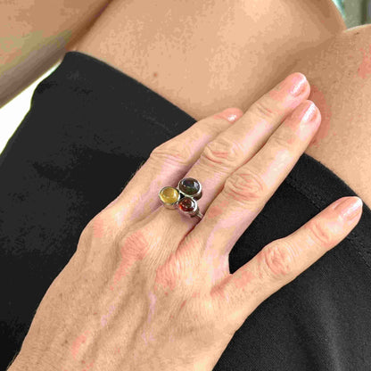 Handmade sterling silver ring with citrine, garnet and cat’s eye gemstones.
