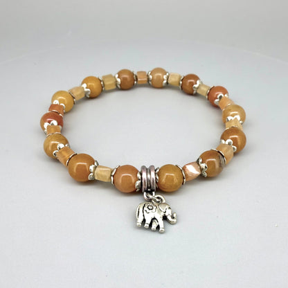 Jade and aventurine beaded bracelet, 18cm, yellow and light brown gemstone beads in round and square shapes with elephant charm on elastic stretch band.