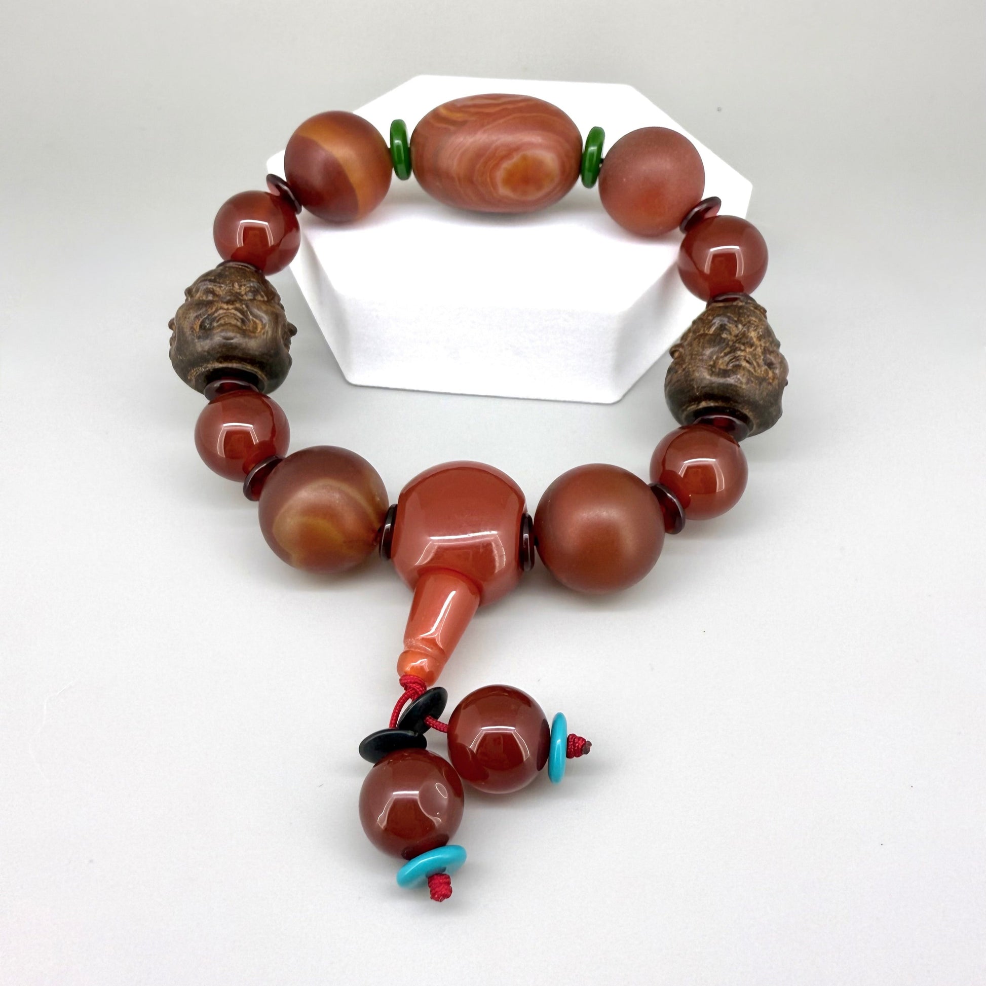 Agate and carnelian beaded bracelet, 20cm, with fiery red, orange, and colorful accent beads on elastic stretch band.