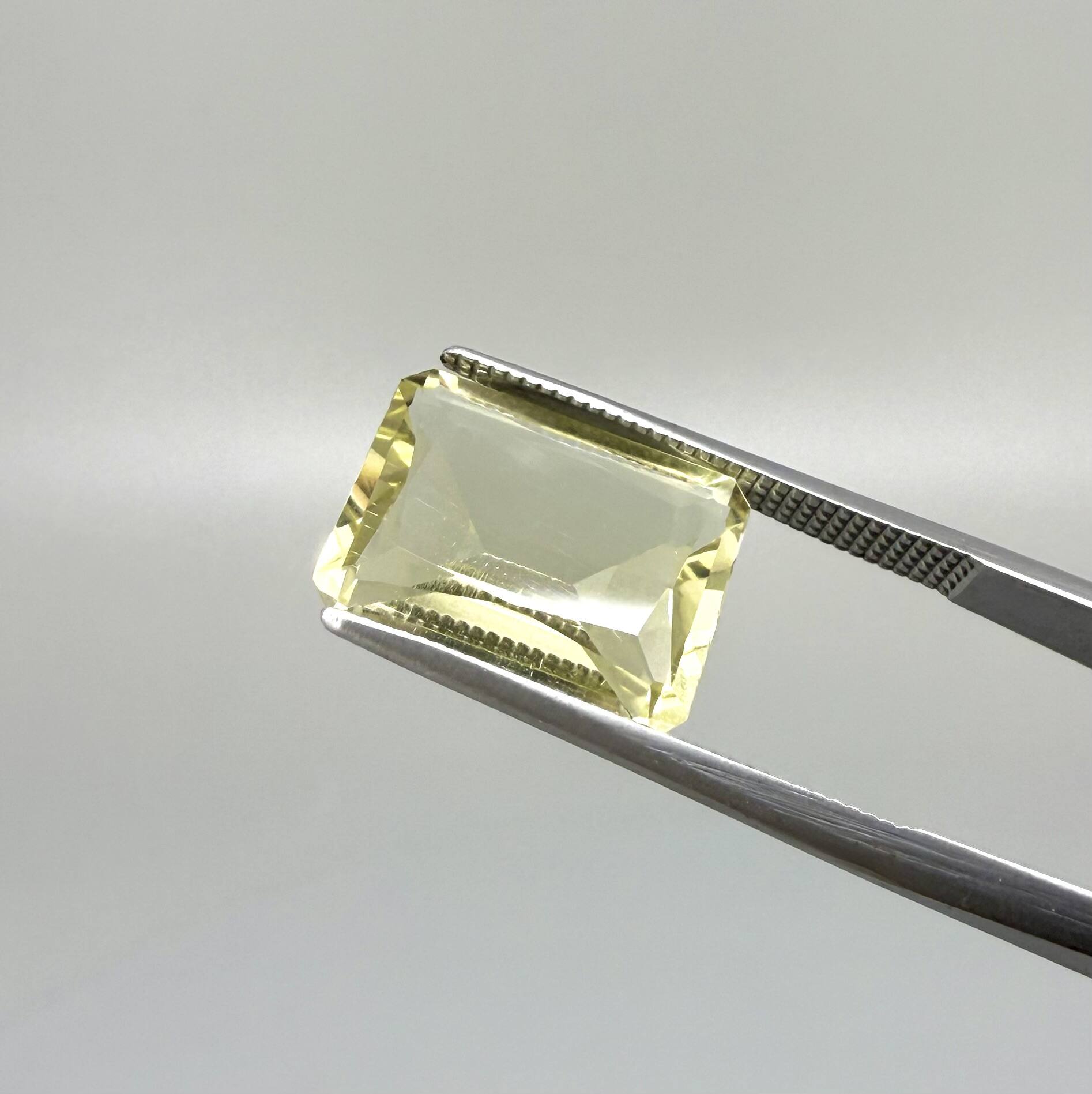 5.6 ct natural lemon quartz, faceted with bright yellow color.