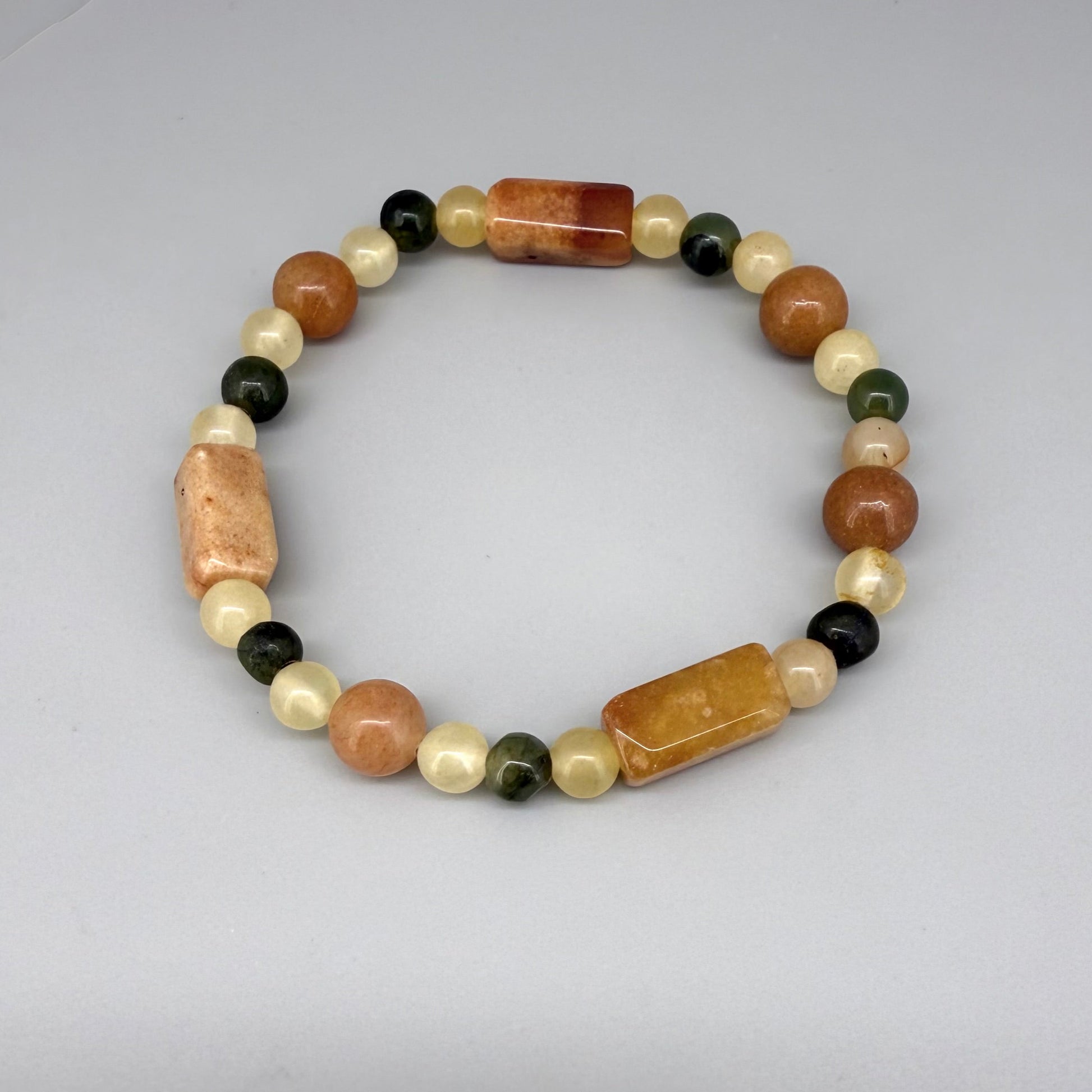 Jade beaded bracelet, 19cm, orange square stones with round beads in orange, green, and beige tones on elastic stretch band.