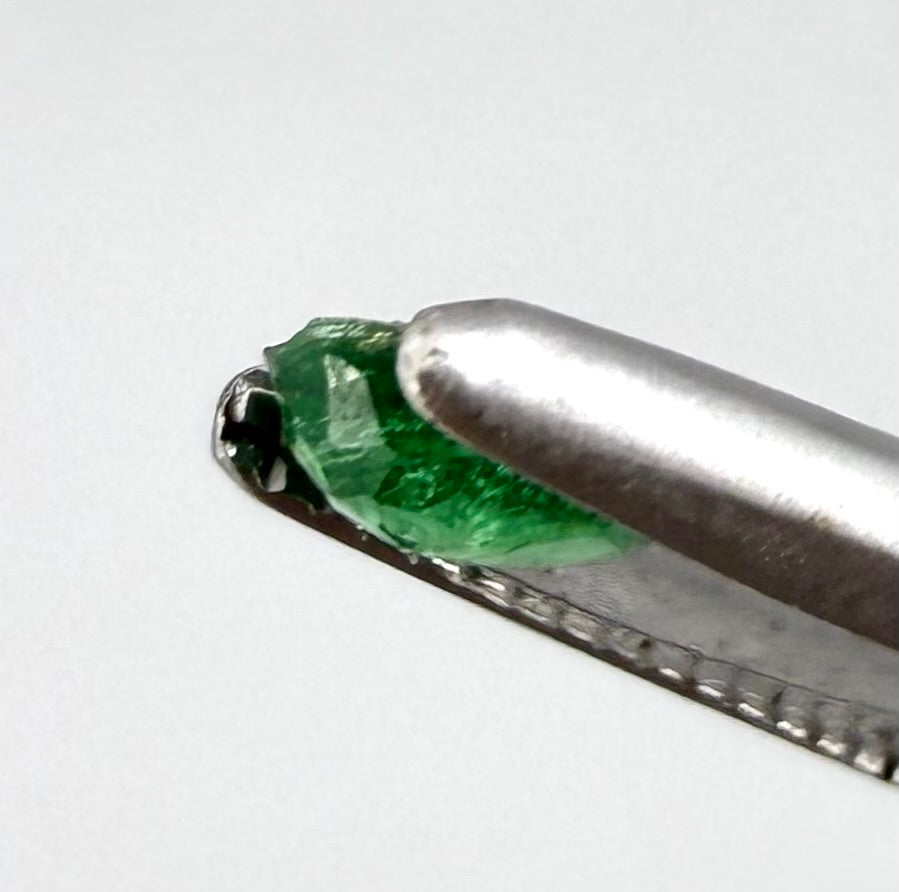 0.16 ct natural untreated Zambian emerald, oval faceted with bright bluish-green color.