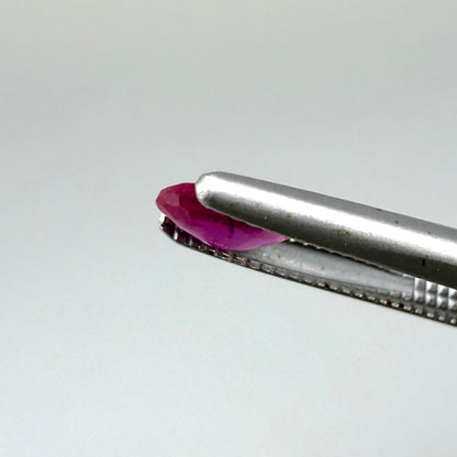 0.32 ct natural pink-red Songea ruby, oval cut.