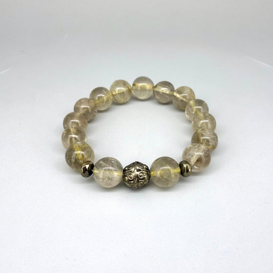 Rutilated quartz beaded bracelet, natural golden rutile gemstone beads with one carved metal accent bead on elastic stretch band.