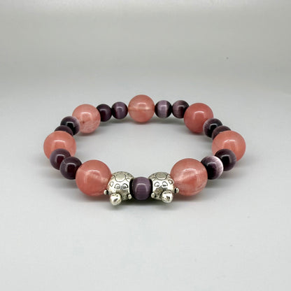 Cherry quartz and cat’s eye beaded bracelet, 18cm, pink and shimmering gemstone beads with two turtle accents on elastic stretch band.