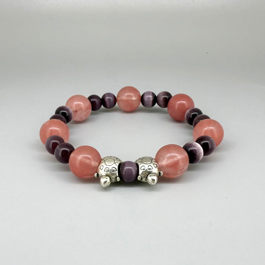 Cherry quartz and cat’s eye beaded bracelet, 18cm, pink and shimmering gemstone beads with two turtle accents on elastic stretch band.