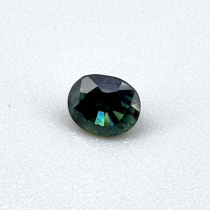0.67 ct natural blue-green sapphire from Bangkaja, faceted cut.